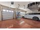 Spacious garage with epoxy floor, overhead storage, and ample room for vehicles and storage at 9270 Valerie Elaine St, Las Vegas, NV 89139