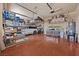 Well-organized garage with epoxy flooring, storage shelves, and overhead racks for maximum space at 9270 Valerie Elaine St, Las Vegas, NV 89139