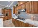 Beautiful kitchen with wood cabinetry, tiled backsplash, and stainless steel appliances at 9270 Valerie Elaine St, Las Vegas, NV 89139