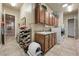 Functional laundry room featuring ample cabinetry, sink, and modern appliances at 9270 Valerie Elaine St, Las Vegas, NV 89139