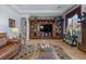 Cozy living room boasts a built-in entertainment center, large windows, and a neutral color palette at 9270 Valerie Elaine St, Las Vegas, NV 89139