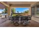 Covered patio with dining set and barbecue for outdoor gatherings and enjoying meals at 9270 Valerie Elaine St, Las Vegas, NV 89139