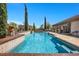 Inviting pool with views of home's exterior and an outdoor kitchen at 9270 Valerie Elaine St, Las Vegas, NV 89139
