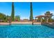 Sparkling pool featuring mature landscaping and pergola, creating an oasis for outdoor enjoyment at 9270 Valerie Elaine St, Las Vegas, NV 89139