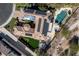 Aerial view of a private estate with a pool, putting green, and solar panels on the roof at 9301 Queen Charlotte Dr, Las Vegas, NV 89145