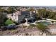 A view of the home's backyard, featuring a pool, patio area, and well-maintained landscaping at 9301 Queen Charlotte Dr, Las Vegas, NV 89145