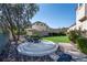 Beautiful backyard with custom patio and lush artificial turf, perfect for outdoor relaxation and entertainment at 9301 Queen Charlotte Dr, Las Vegas, NV 89145