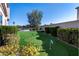 Lush artificial turf in the backyard is a great place to practice your short game on this putting green at 9301 Queen Charlotte Dr, Las Vegas, NV 89145