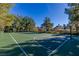 Well-maintained community basketball court surrounded by trees and greenery at 9301 Queen Charlotte Dr, Las Vegas, NV 89145