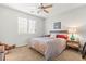 Bedroom with a queen sized bed, night stand and carpet at 9301 Queen Charlotte Dr, Las Vegas, NV 89145