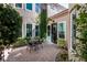 Cozy courtyard with brick-paved patio, outdoor seating, and lush landscaping, ideal for relaxation at 9301 Queen Charlotte Dr, Las Vegas, NV 89145