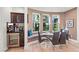Bright dining area with built-in bar, seating, and tile flooring at 9301 Queen Charlotte Dr, Las Vegas, NV 89145