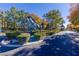 Grand entrance featuring a large horse statue, lush landscaping, and a view of a gazebo at 9301 Queen Charlotte Dr, Las Vegas, NV 89145