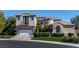 Beautiful two-story home with a three-car garage and well-maintained landscaping at 9301 Queen Charlotte Dr, Las Vegas, NV 89145