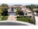 Beautiful two-story home with a landscaped yard, brick driveway, and a two-car garage at 9301 Queen Charlotte Dr, Las Vegas, NV 89145