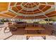 Spacious gazebo interior with picnic tables and outdoor cooking facilities at 9301 Queen Charlotte Dr, Las Vegas, NV 89145