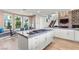 Gourmet kitchen with a large island, gas cooktop, and breakfast nook at 9301 Queen Charlotte Dr, Las Vegas, NV 89145