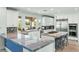 Spacious kitchen with granite countertops, white cabinetry, and stainless steel appliances at 9301 Queen Charlotte Dr, Las Vegas, NV 89145