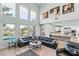 Open living area with high ceilings, fireplace, and backyard pool view at 9301 Queen Charlotte Dr, Las Vegas, NV 89145