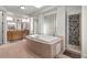 Bright main bathroom with large tub, natural light, and dual vanities at 9301 Queen Charlotte Dr, Las Vegas, NV 89145