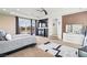 Comfortable main bedroom with carpet, TV, and balcony access at 9301 Queen Charlotte Dr, Las Vegas, NV 89145