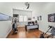 Office features a large desk, exercise equipment and hardwood floors at 9301 Queen Charlotte Dr, Las Vegas, NV 89145