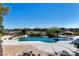 Stunning pool area featuring a built-in bar and a view of the surrounding community at 9301 Queen Charlotte Dr, Las Vegas, NV 89145