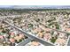 Wide aerial shot of a peaceful residential neighborhood with picturesque houses and lush greenery in a serene setting at , Henderson, NV 89074