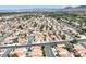 Scenic aerial view of a suburban neighborhood featuring neatly arranged homes and well-maintained streets against a mountain backdrop at , Henderson, NV 89074