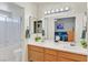 Well-lit bathroom with a double sink vanity and shower-tub combination at , Henderson, NV 89074
