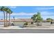 Charming single-story home with well-maintained landscaping, mature trees, and a welcoming facade on a sunny day at , Henderson, NV 89074