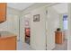 Hallway with doors that lead to a bedroom and bathroom area, features neutral paint and tile floors at , Henderson, NV 89074