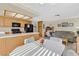 Open-concept kitchen and dining area with bar seating and adjacent living space at , Henderson, NV 89074