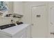 Laundry room equipped with a washer, dryer, shelving, and utility closet at , Henderson, NV 89074