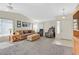 Bright living room features plush carpeting, comfortable seating, and natural light, perfect for relaxation and entertaining at , Henderson, NV 89074