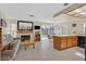Bright living area with fireplace, kitchen island, and view of the pool at , Henderson, NV 89074