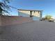Spacious backyard featuring a retaining wall with low maintenance landscaping opportunities at 10148 Cluny Ave, Las Vegas, NV 89178