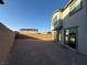 Spacious backyard featuring a retaining wall with low maintenance landscaping opportunities at 10148 Cluny Ave, Las Vegas, NV 89178