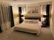Calming bedroom features a king bed, soft lighting, and stylish window treatments at 10148 Cluny Ave, Las Vegas, NV 89178