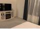Bedroom with fireplace and entertainment center at 10148 Cluny Ave, Las Vegas, NV 89178