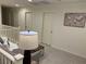 Cozy loft area with neutral colors, carpet, and a decorative world map at 10148 Cluny Ave, Las Vegas, NV 89178