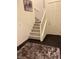 Carpeted staircase and landing offers an open and inviting transition to the upper level at 10148 Cluny Ave, Las Vegas, NV 89178