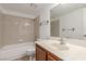 Bathroom featuring a vanity with storage, tile flooring, and shower/tub combo at 1017 Falconhead Ln # 101, Las Vegas, NV 89128