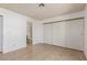 A roomy bedroom featuring tile floors, a large closet and ensuite bath at 1017 Falconhead Ln # 101, Las Vegas, NV 89128