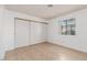 A roomy bedroom featuring tile floors and a large closet at 1017 Falconhead Ln # 101, Las Vegas, NV 89128