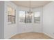 Bright dining area with tiled floors, ample natural light, and a modern chandelier at 1017 Falconhead Ln # 101, Las Vegas, NV 89128