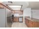 Efficient kitchen with stainless steel appliances, granite countertops, and ample cabinet space at 1017 Falconhead Ln # 101, Las Vegas, NV 89128