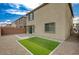 Enjoy this backyard with sliding glass doors that open onto an artificial turf at 10198 Eden Mountain St, Las Vegas, NV 89141