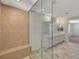 Bright bathroom features marble floors, a glass shower enclosure and dual sinks at 10198 Eden Mountain St, Las Vegas, NV 89141