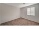 Bright bedroom featuring neutral walls, carpet, window, and ample natural light at 10198 Eden Mountain St, Las Vegas, NV 89141